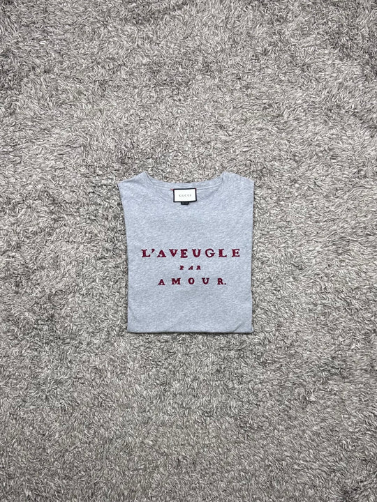 Gucci T-shirt traforata con scritta rossa