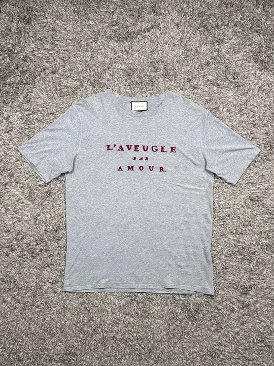Gucci T-shirt traforata con scritta rossa