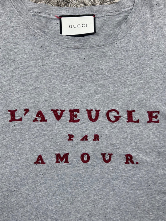 Gucci T-shirt traforata con scritta rossa