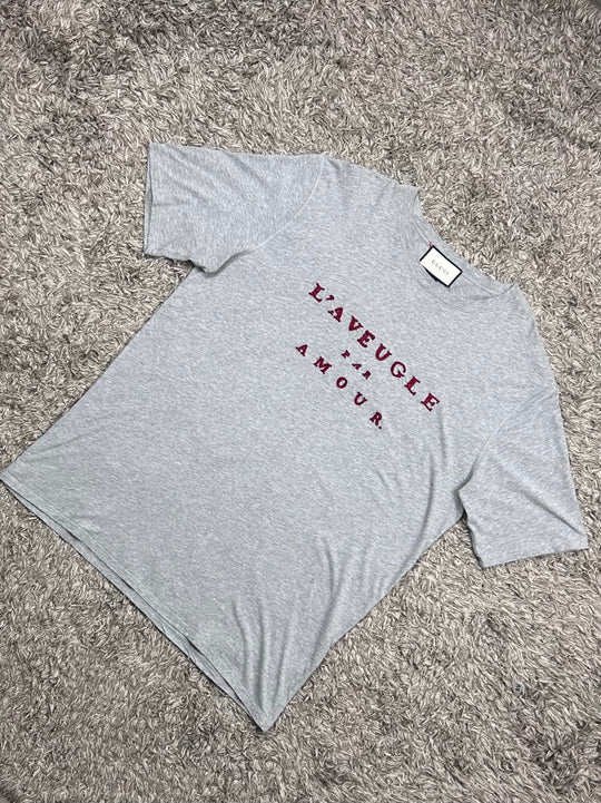 Gucci T-shirt traforata con scritta rossa
